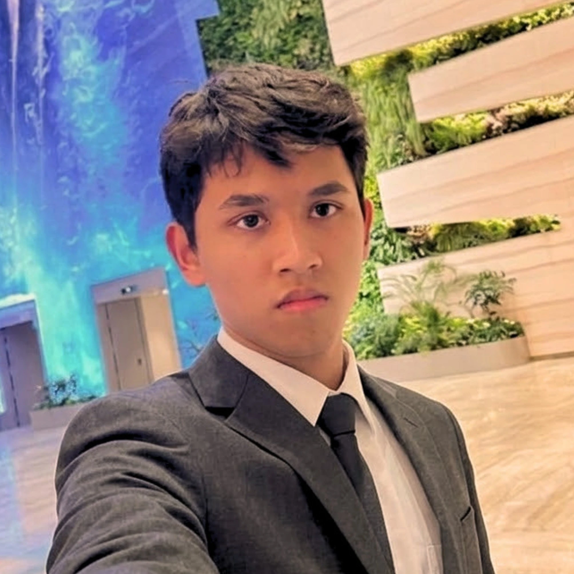Sabik Bin Sultan wearing a suit and tie